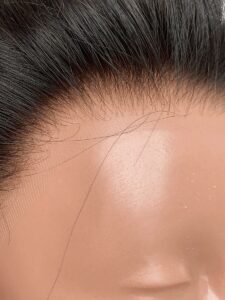 Extra thin hairline wig showing a natural-looking hairline with fine lace and low-density front mimicking real hair growth.